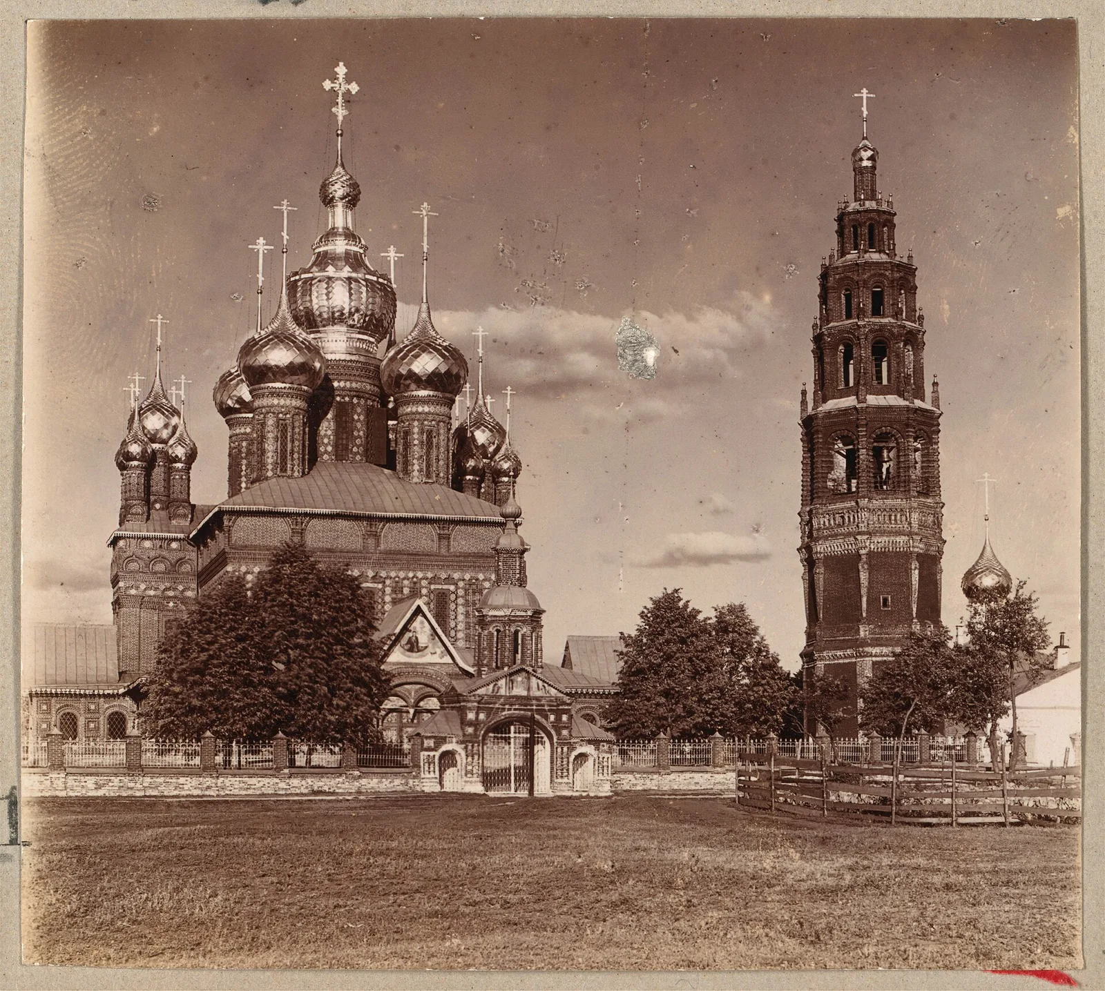 Early photograph of a many-domed church with a tall separate bell tower
